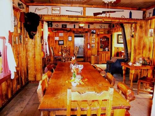 Long wooden table set in the ranch house dining room